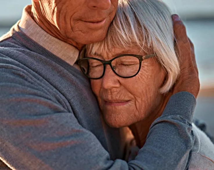 Husband providing caregiver support to wife